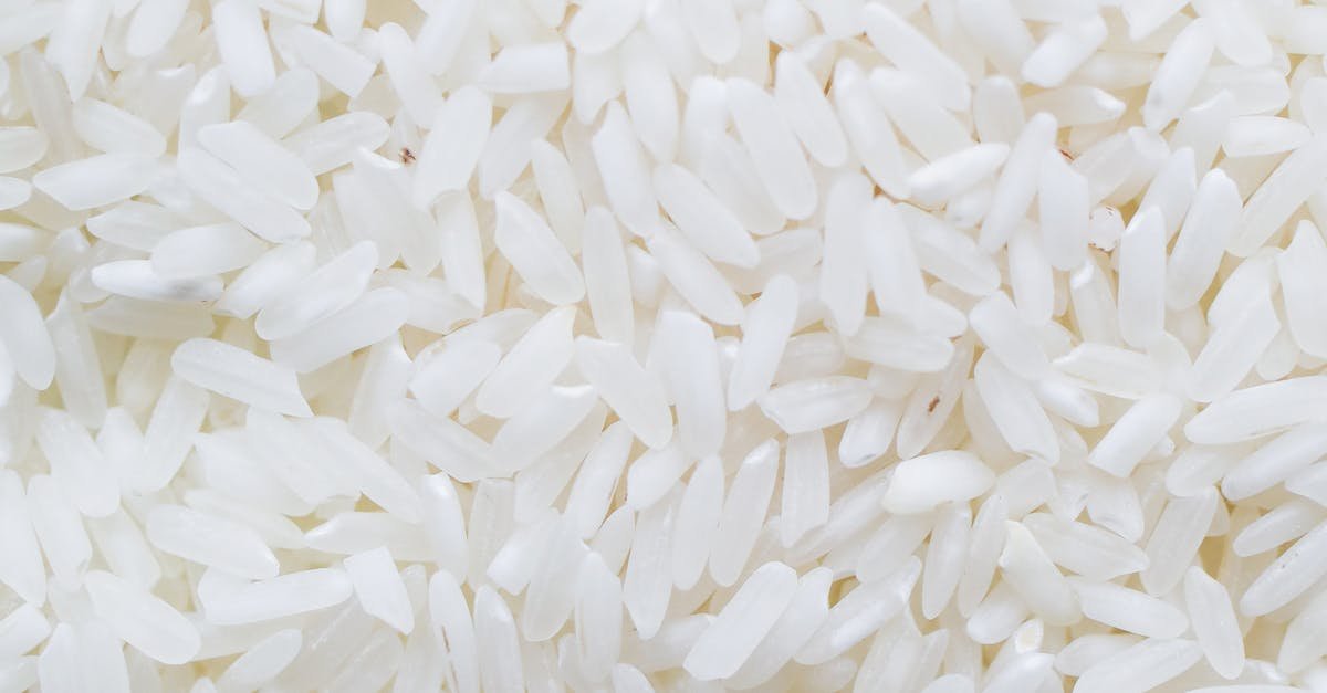 A detailed close-up shot showcasing a generous amount of white rice grains, ideal for culinary themes.